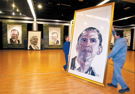 Workers in Beijing put up a portrait of US President Barack Obama on Monday at an exhibition featuring portraits of 23 world leaders who will attend the G20 summit in London tomorrow.[China Daily]