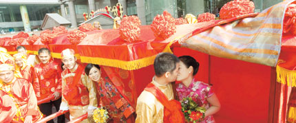 Young couples hold a traditional wedding in Shanghai. Although the coming lunar new year is considered a 'widow year,' it hasn't affected wedding plans in Shanghai and prices have increased by 5 to 10 percent because of high demand.