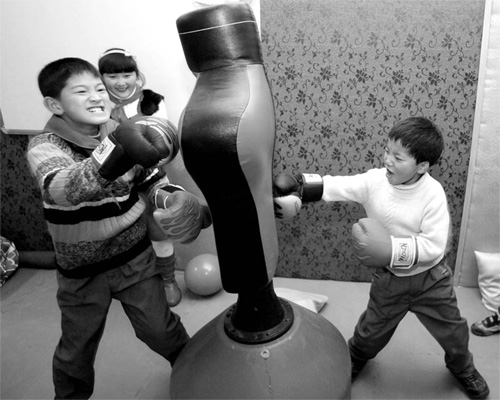 Children from Deyang of Sichuan province, which was hit hard by an earthquake two years ago, play at a psychological consultation center in this file photo.