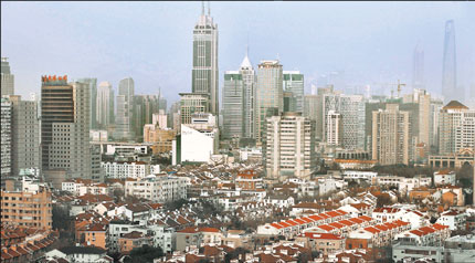A general view shows buildings in the center of Shanghai. Sales of new homes plunged 56 percent to 3.57 million square meters in the city during the first half of this year as government policies launched since mid-April to curb housing speculation have damped buying sentiment. [Shanghai Daily]