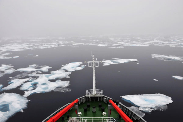 The icebreaker Xuelong, or Snow Dragon, sails through floe ice in the Arctic, Aug 28, 2010. The icebreaker Xuelong of China's fourth scientific expedition team to the North Pole reached a spot at 74 degrees north latitude of the Arctic Ocean to conduct comprehensive marine research, Aug 29, 2010.