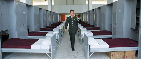 A member of the PLA honor guard walks through its dormitory at a university in Mexico City. 