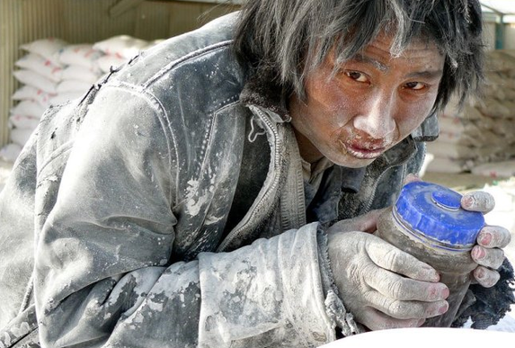 A mentally ill worker rests at a construction site at the Jiaersi Green Construction Material Chemical Factory in Toksun county, Northwest China&apos;s Xinjiang Uygur autonomous region.