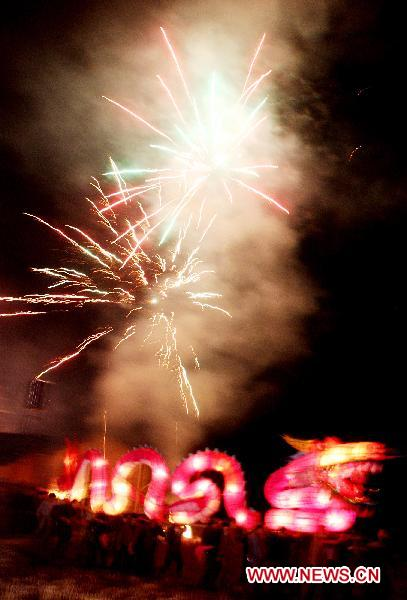 A dragon lantern carried by wooden benches is seen during a lantern parade in Dexing, east China's Jiangxi Province, Feb. 8, 2011. Over 200 people took part in a lantern parade celebrating the Chinese Lunar New Year here on Tuesday. 