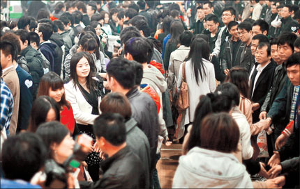 Young men and women try to find their Mr or Miss Right at a matchmaking event held at a stadium in Jing'an District yesterday.  