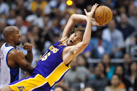 Pau Gasol (R) of Lakers falls during the NBA basketball game against Clippers at Staples Center, Los Angeles, CA, the U.S.A., Oct. 29, 2008.