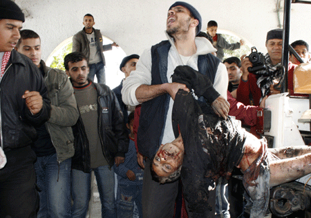 A Palestinian who was injured in an Israeli army strike is rushed to Shifa hospital in Gaza City, Tuesday, Jan. 13, 2009.