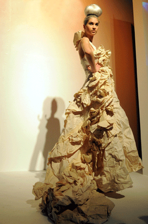 A model displays costumes during an environment-friendly fashion show in east China's Shanghai, Jan. 14, 2009. The materials used to make the costumes displayed during the show on Wednesday covered organic cotton, silk, ramie and reused fabric. 