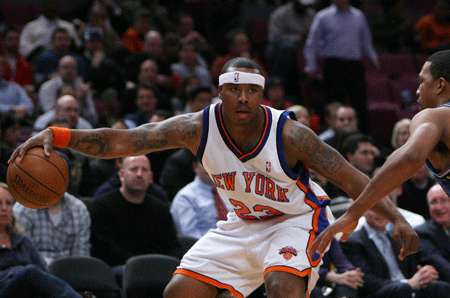 New York Knicks Quentin Richardson (L) drives the ball during the NBA game against Washington Wizards in New York, the United States, Jan. 14, 2009. Knicks won 128-122. 