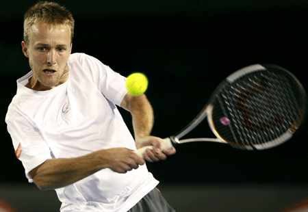 Belgium's Christophe Rochus returns to Spain's Rafael Nadal during a match of the first round of the men's singles at the Australian Open tennis tournament in Melbourne Jan. 20, 2009. Rochus lost 0-3. 