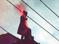 Rooftop suicide leads to removal of senior official