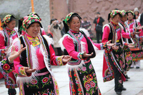 Residents celebrate the reconstruction of their village with a traditional Guozhuang dance.
