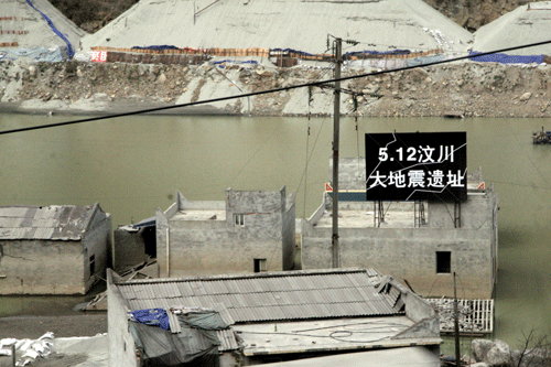 A black sign marks abandoned houses in Wenchuan, epicenter of the earthquake that hit Sichuan Province on May 12, 2008, killing 69,227 people and injuring 374,643. 17,923 people are missing, presumed dead.