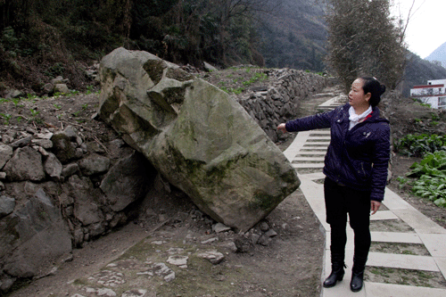 Falling boulders made much of the farmland around Xu Xingzhi's village unusable.