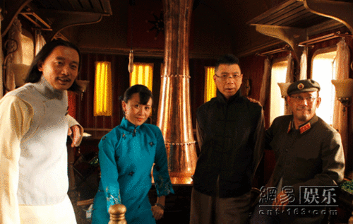 This undated photo shows (from L to R) cast members Ge You, Carina Lau, Feng Xiaogang and director Jiang Wen on the set of 'Let the Bullets Fly.' 