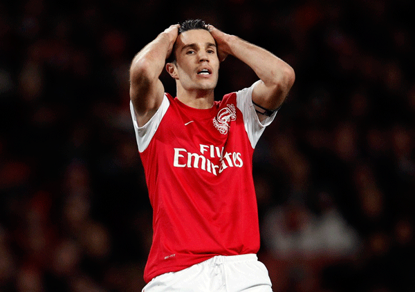 Robin Van Persie reacted after missing a chance during an English Premier League soccer match at the Emirates Stadium in London, Britain, 27 December 2011.