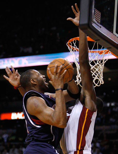  Tracy MacGrady of Atlanta tries to go basket past Miami's Joel Anthony during the second half of Atlanta's 100-92 win in an NBA basketball game on Monday, Jan. 2, 2012.