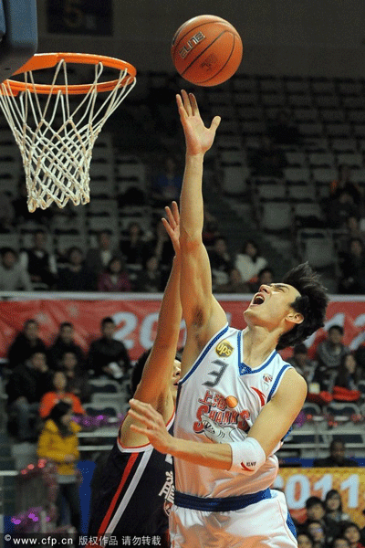 Liu Ziqiu of Shanghai Sharks goes up for a basket during a CBA game between Shanghai Sharks and Foshan Dralions on Jan.4, 2012.