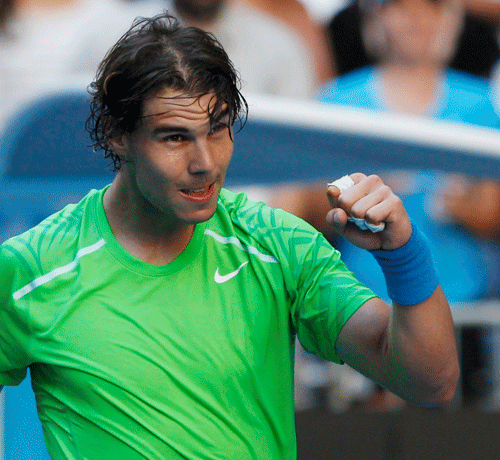 Rafael Nadal celebrates his victory over Alex Kuznetsov in the first round of Australian Open on Jan.16, 2012. [Source:Sina.com]