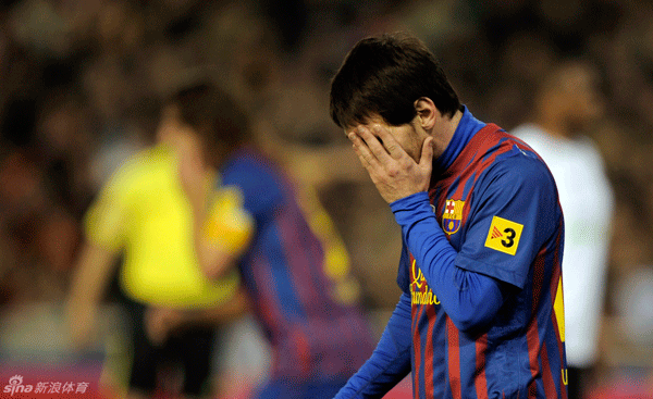  Leo Messi of Barcelona reacts after missing the penalty during the first leg of Copa del Rey semifinal between Barcelona and Valencia at the Mestalla Stadium on February 2, 2012.