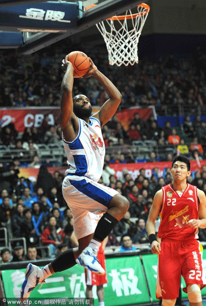 Marcus Landry of Shanghai Sharks slams dunk during a CBA game between Shanghai Sharks and Bayi Rockets on February 5, 2012.