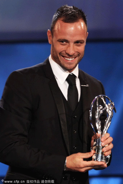  Athlete Oscar Pistorius with his Laureus World Sportsperson of the Year with a Disability trophy on stage at the 2012 Laureus World Sports Awards at Central Hall Westminster on February 6, 2012 in London, England.