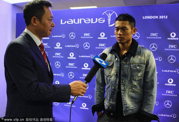  Chinese Badminton player Lin Dan is interviewed during a press conference prior to the Laureus World Sports Awards 2012 on February 5, 2012 in London, England.