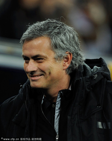 Real Madrid head coach Jose Mourinho smiles before the start of the La Liga match between Real Madrid and Real Zaragoza at Estadio Santiago Bernabeu on January 28, 2012 in Madrid, Spain. 