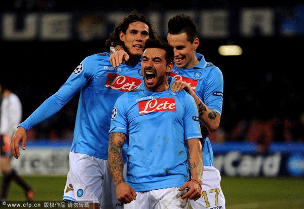  Ezequiel Lavezzi (C) of Napoli celebrates with teammates Edinson Cavani (L) and Marek Hamsik (R) after scoring his team's third goal during the UEFA Champions League round of 16 first leg match between SSC Napoli and Chelsea FC at Stadio San Paolo on February 21, 2012 in Naples, Italy. 