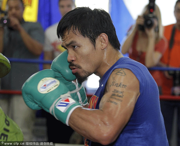  Manny Pacquiao trains for his upcoming boxing match with Timothy Bradley Jr..