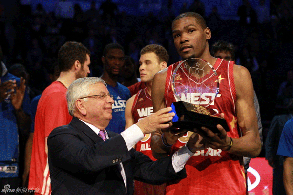 Commissioner David Stern presents the Most Valuable Player trophy to Western Conference's Kevin Durant of the Oklahoma City Thunder after the NBA All-Star basketball game on Sunday, Feb. 26, 2012, in Orlando, Florida.