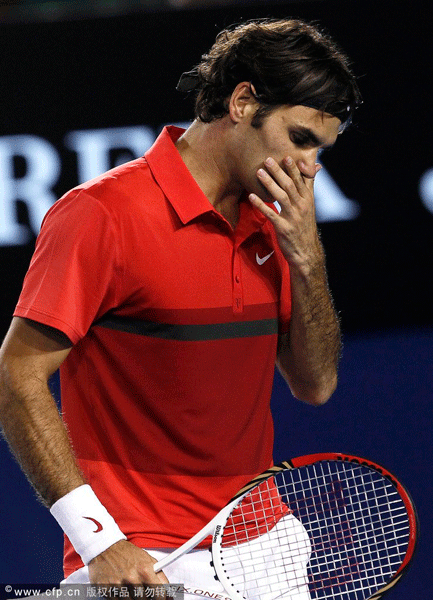 Roger Federer of Switzerland reacts after losing a point during his semi final match against Rafael Nadal of Spain at the Australian Open Grand Slam Tennis Tournament in Melbourne, Australia, 26 January 2012. 
