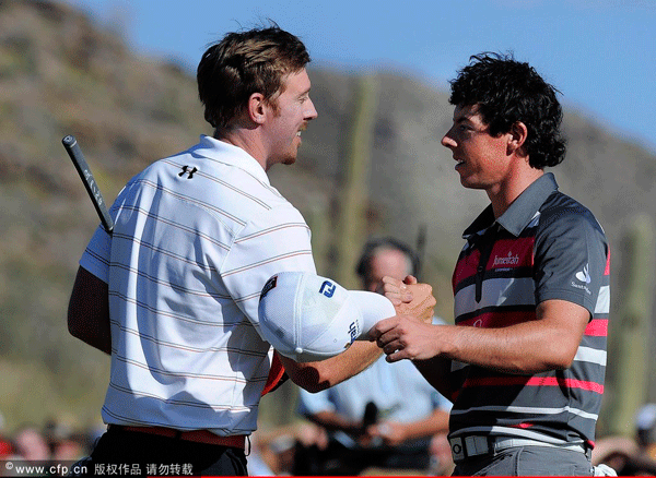 Hunter Mahan shakes hands with Rory McIlroy of Northern Ireland after winning the championship match 2 and 1 on the 17th hole during the final round of the World Golf Championships-Accenture Match Play Championship at the Ritz-Carlton Golf Club on February 26, 2012 in Marana, Arizona.