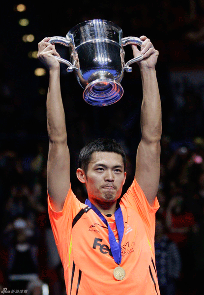 Lin Dan of China lifts the trophy on March 11, 2012 following his victory over Lee Chon Wei of Malaysia during the men's singles final of the All-England Open badminton championships at the National Indoor Arena in Birmingham.