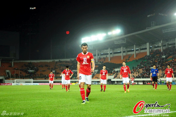 Dejected Evergrand players walked off the pitch after losing to Buriram United in a AFC Champions League game in Guangzhou on March 21, 2012.