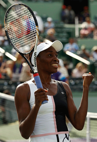 Venus Williams reacts after beating Japan's Kimiko Date-Krumm 6-0, 6-3 in the first round match at the Sony Ericsson Open in Key Biscayne, Florida on March22, 2012.[Source:Sina.com]