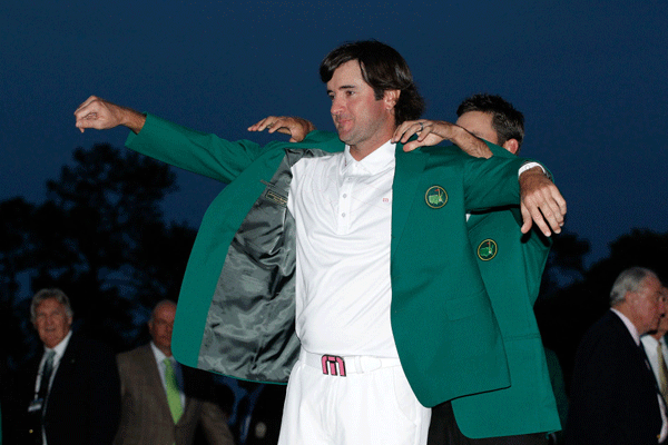Emerging out of a field of veteran golf masters, surprise winner Bubba Watson dons the green jacket at Augusta.