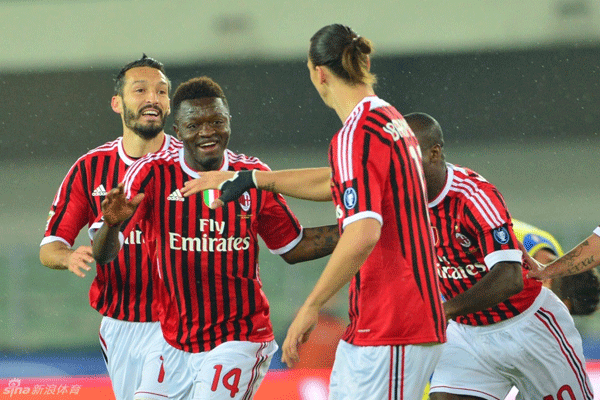 Sulley Muntari is mobbed after scoring Milan's early winning goal against Chievo in a Serie A match on April 10, 2012.
