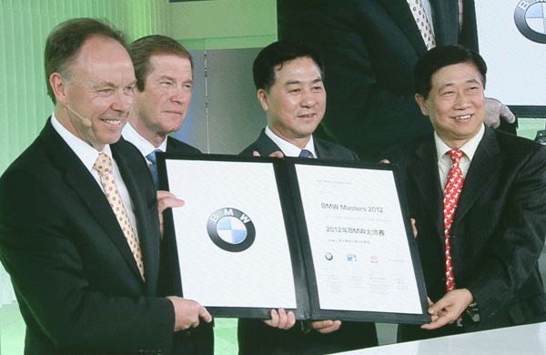  (L-R) BMW's Sales and Marketing Director Ian Robertson, European Tour Chief Executive George O'Grady, China Golf Association Vice Chairman Zhang Xiaoning and SRE Group Chairman Shi Jian attend the signing ceremony for the Shanghai Masters to join the European Tour at the Beijing International Automotive Exhibition on April 23, 2012.