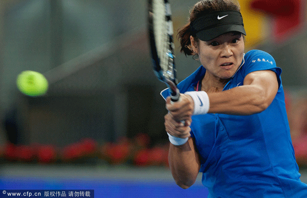  Tennis player Na Li of China returns the ball to Silvia Soler Espinosa of Spain during the second round of the WTA Mutua Madrilena Madrid Open Tennis on May 8, 2012 in Madrid, Spain.