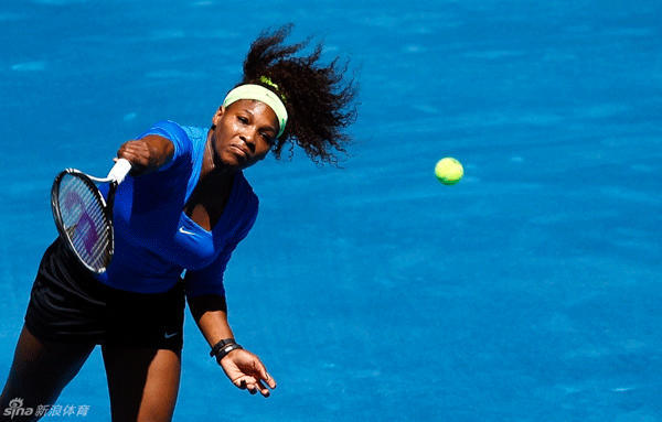 Serena Williams serves to Caroline Wozniacki during the second round match at Madrid Open on May 10, 2012.