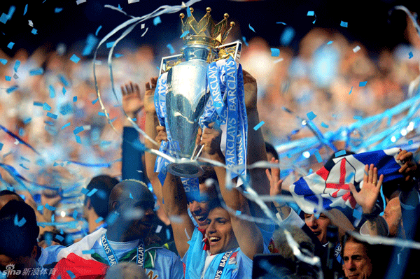 Manchester City's jubilant players lift the Premier League trophy after the late drama.