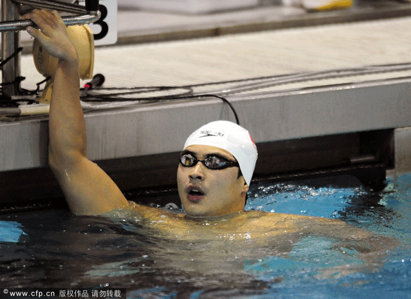 Peng Wu catches his breath after winning the Men's 200 LC Meter Butterfly 3 A-Final on Saturday, May 12, 2012, at the 2012 NC Charlotte UltraSwim in the Mecklenburg County Aquatic Center in Charlotte, North Carolina.