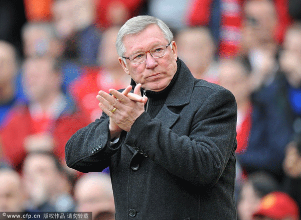 Alex Ferguson applauds fans prior to kick-off of the match between Manchester United and Sunderland on May 13, 2012.