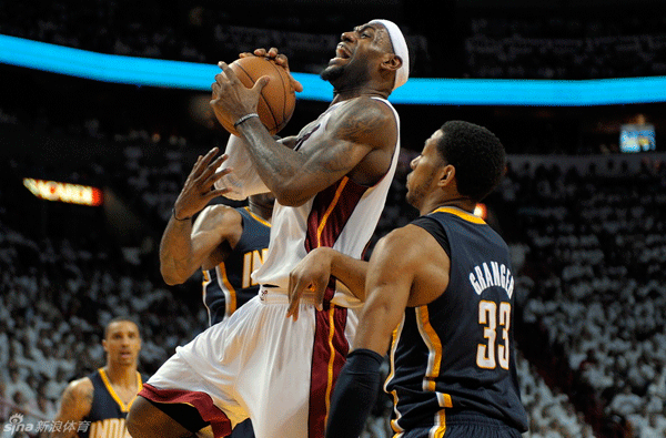 Miami Heat forward LeBron James drives to the basket through the Indiana Pacers defense during the third quarter in Game 2 of the NBA Eastern Conference Semifinals at American Airlines Arena in Miami, Florida, on Tuesday, May 15, 2012.