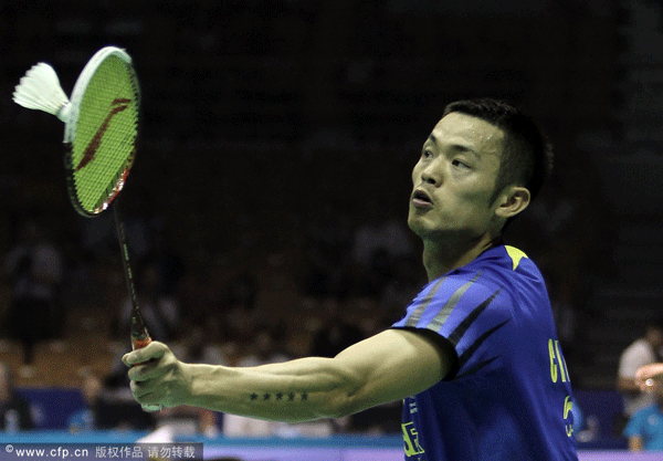 Lin Dan of China returns a shot during men's singles quarterfinal match in the Thomas Cup in Wuhan, Hubei Province, yesterday.