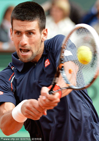 Novak Djokovic of Serbia returns to Andreas Seppi of Italy during their round of 16 match for the French Open tennis tournament at Roland Garros in Paris, France on June 3, 2012.