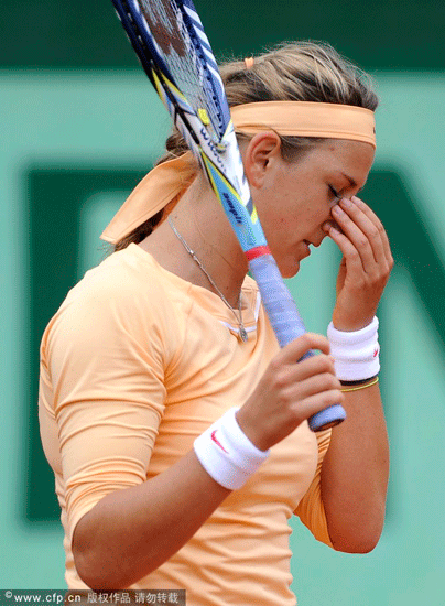 Victoria Azarenka of Belarus reacts during her round of 16 match against Dominika Cibulkova of Slovakia for the French Open tennis tournament at Roland Garros in Paris, France on June 3, 2012.