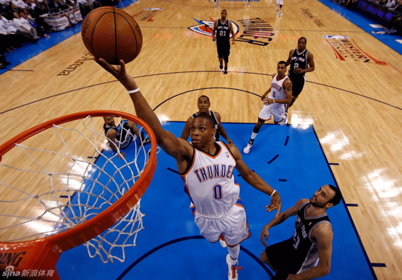 Oklahoma City Thunder point guard Russell Westbrook drives to the basket against San Antonio Spurs shooting guard Manu Ginobili during the second half of Game 6 of the NBA Western Conference basketball finals in Oklahoma City, Oklahoma, June 6, 2012.