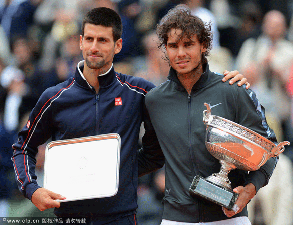  Novak Djokovic of Serbia poses with Rafael Nadal of Spain after the men's singles final during day 16 of the French Open at Roland Garros on June 11, 2012 in Paris, France.